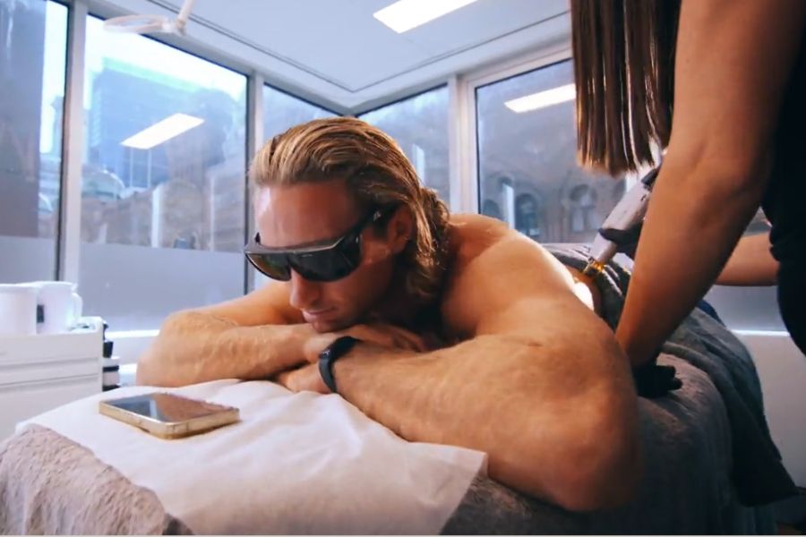 Client receiving laser hair removal treatment